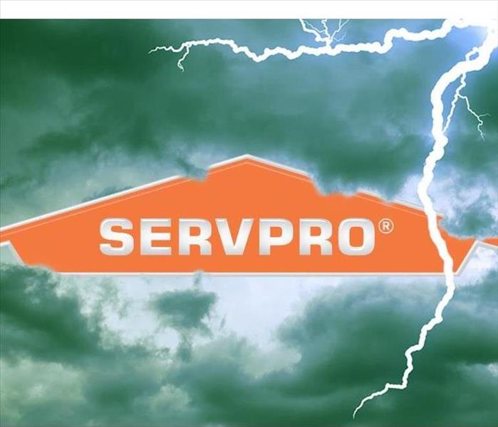 SERVPRO logo on a backdrop of stormy clouds.