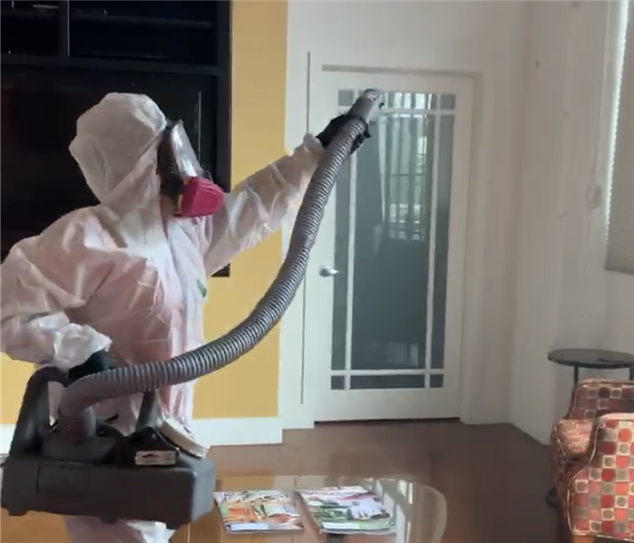 SERVPRO employee disinfecting a home